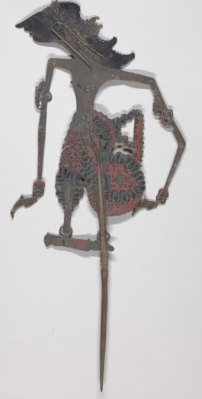 Historic Indonesian painted and gilded leather wayang kulit shadow puppet from the Smithsonian collection